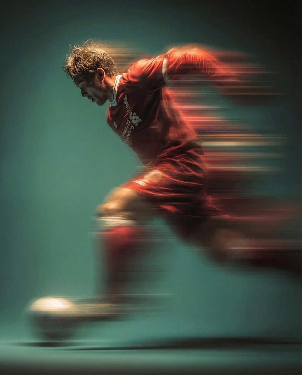 Panning shot of a mysterious soccer player in red proffesional soccer…