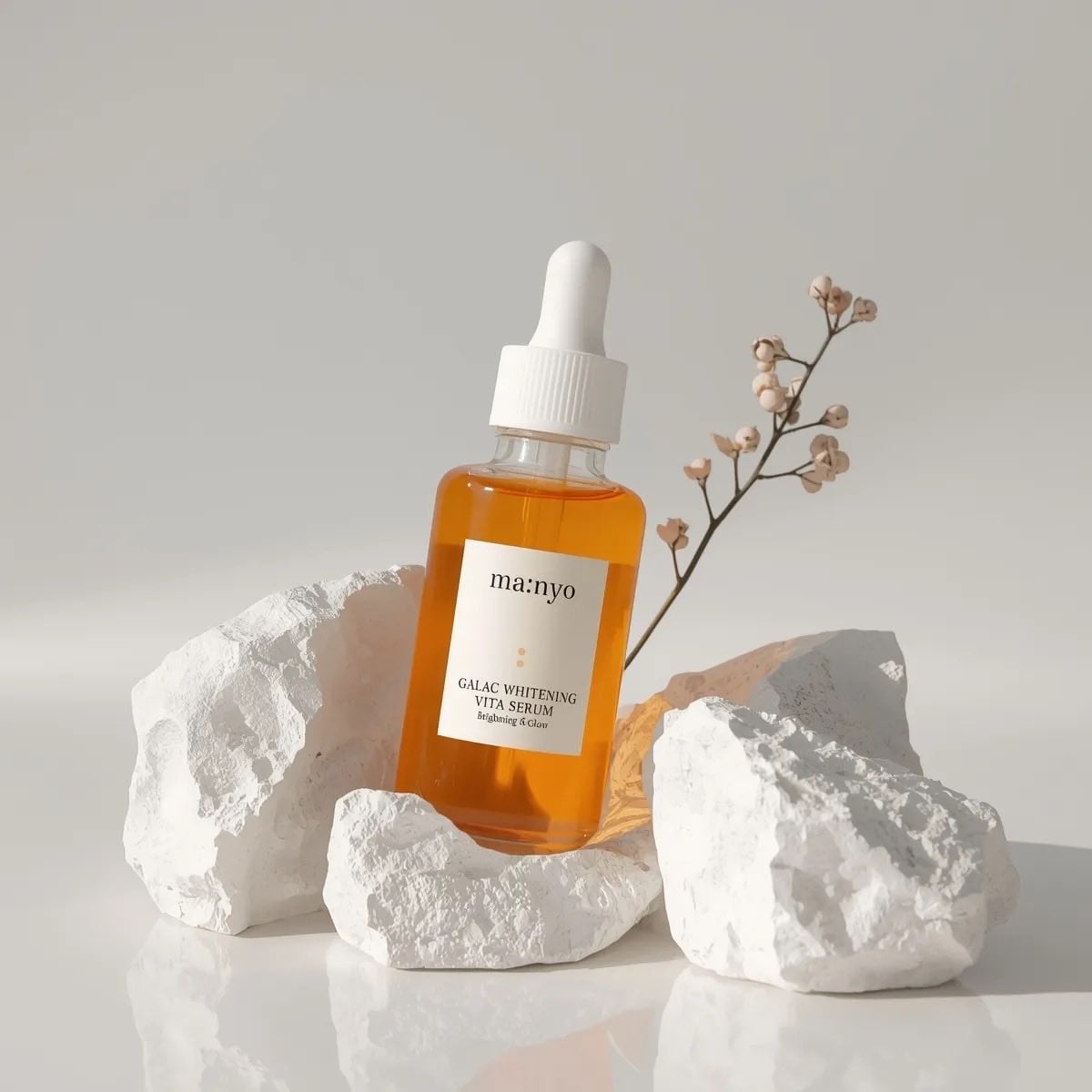 Minimalist studio product photography of an amber glass dropper serum…