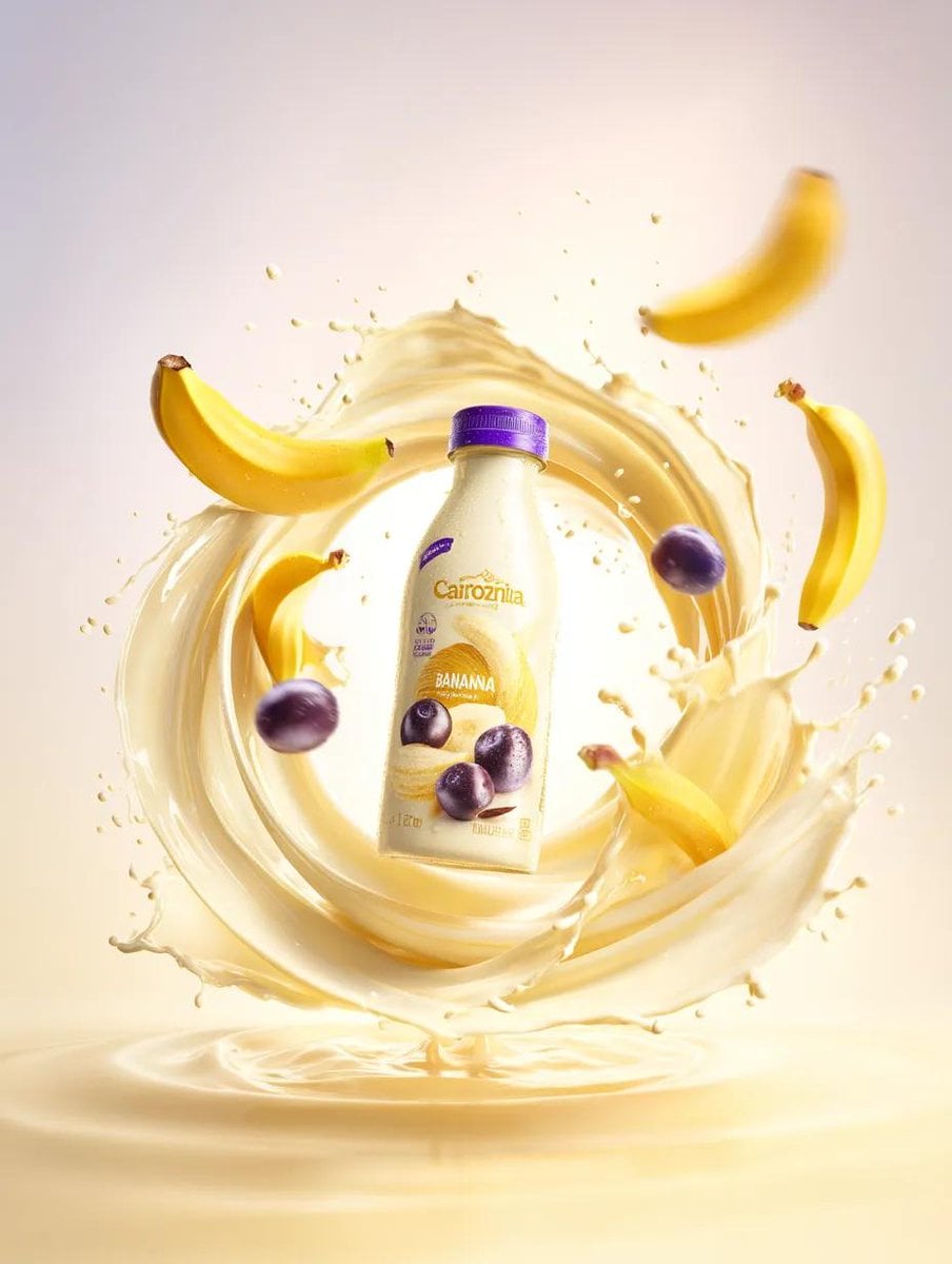 Premium banana milk drink bottle surrounded by swirling milk splash,…