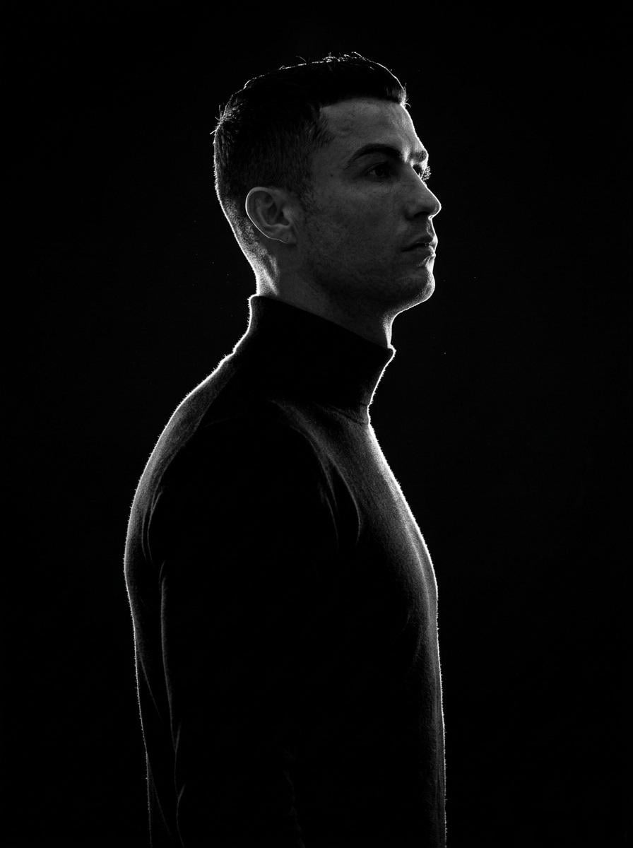 A minimalist black and white cinematic portrait featuring two individ…