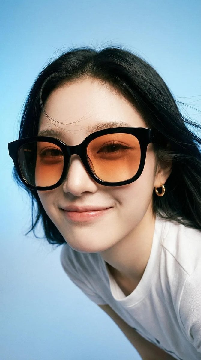 Photorealistic editorial portrait of a smiling woman using the exact…