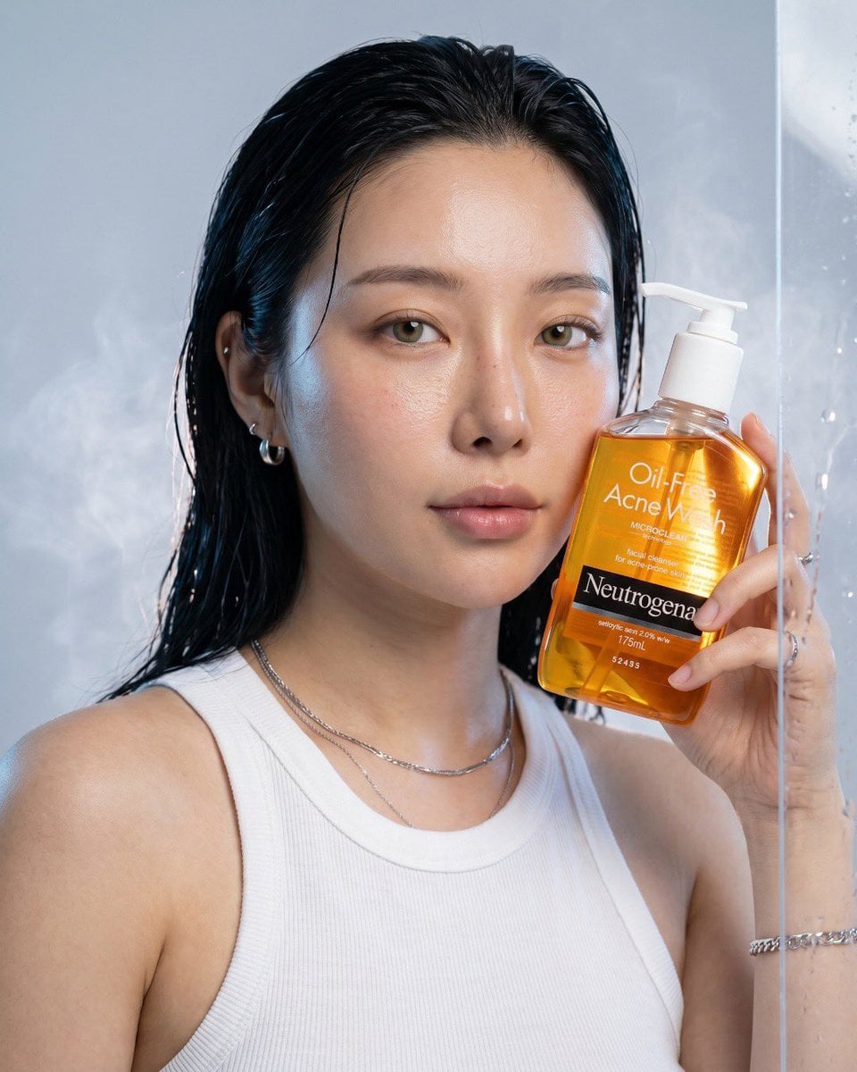 Ultra-realistic luxury skincare advertisement for Neutrogena Oil-Free Acne Wash, premium commercial product p…