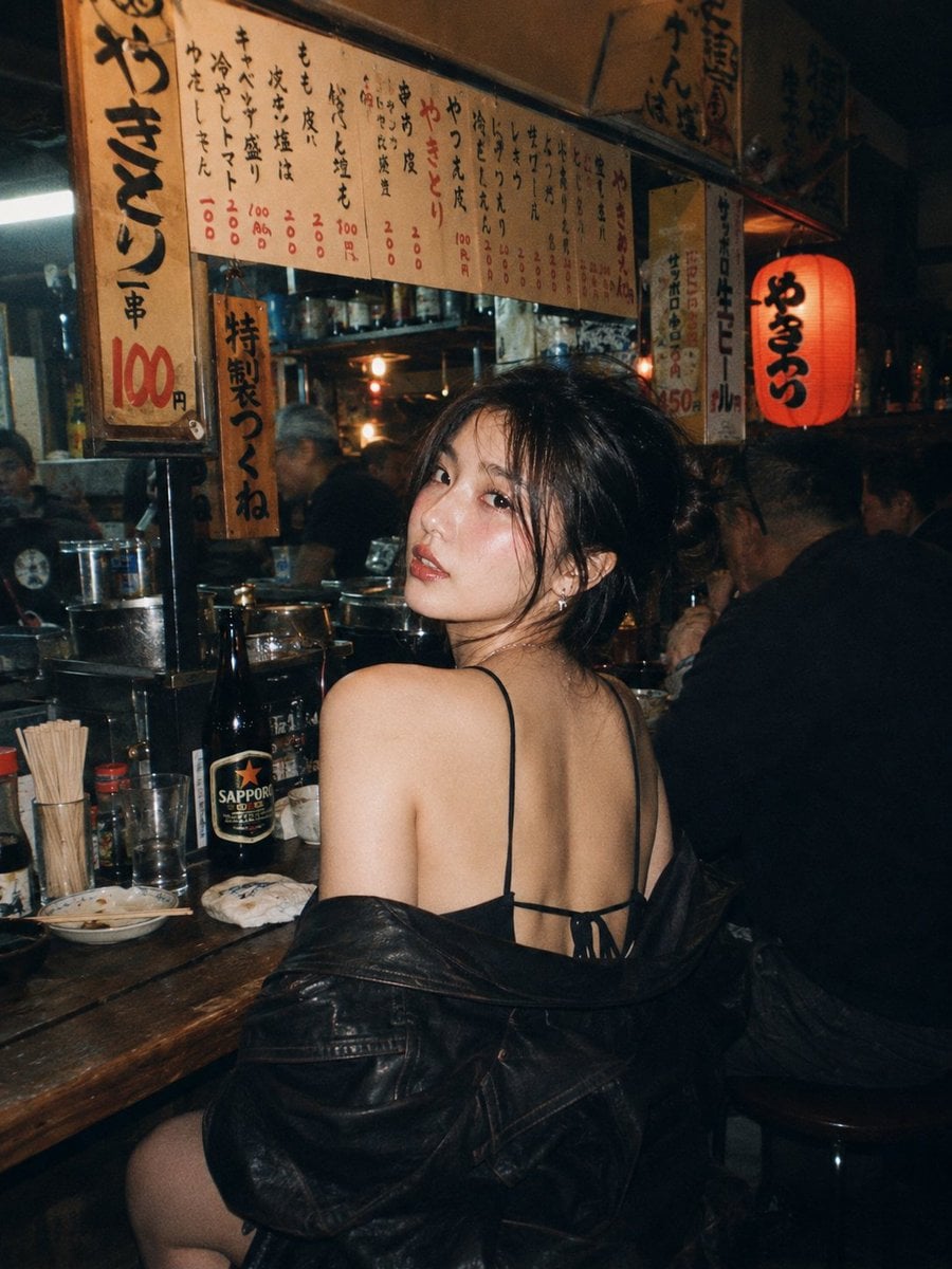 A beautiful young East Asian woman with long dark wavy hair and strik…