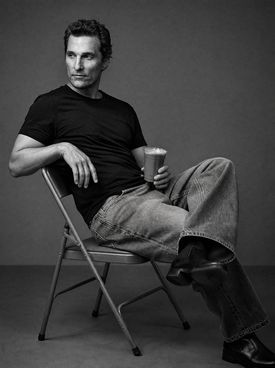 Create a black and white studio image of the person in the uploaded i…