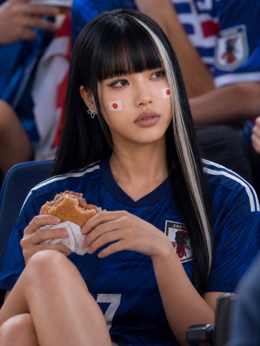 Ultra-realistic portrait of a stylish young woman at a packed footbal…