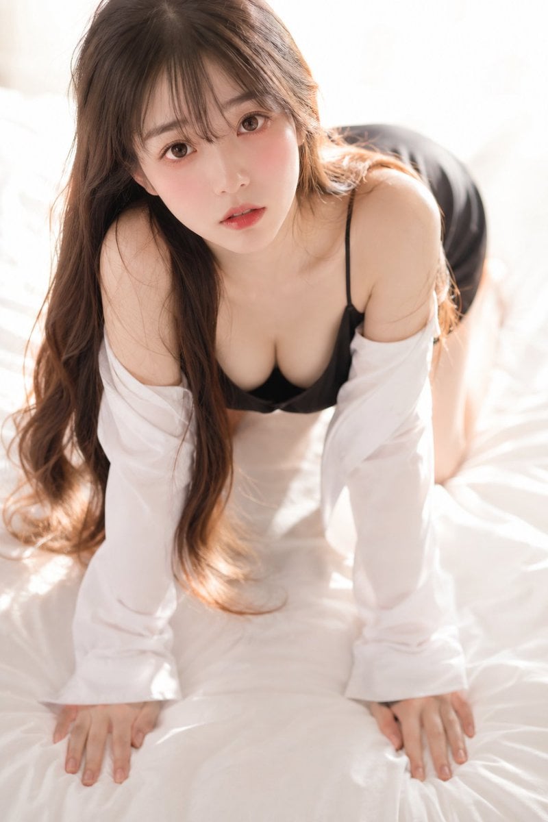 A soft, intimate 35mm photograph shot from slightly above, looking do…