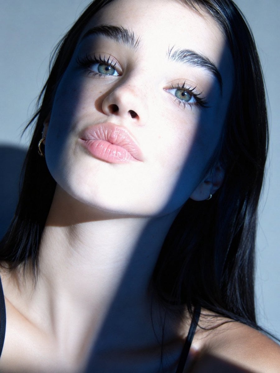 Ultra-realistic beauty portrait captured in a tight close-up with a f…